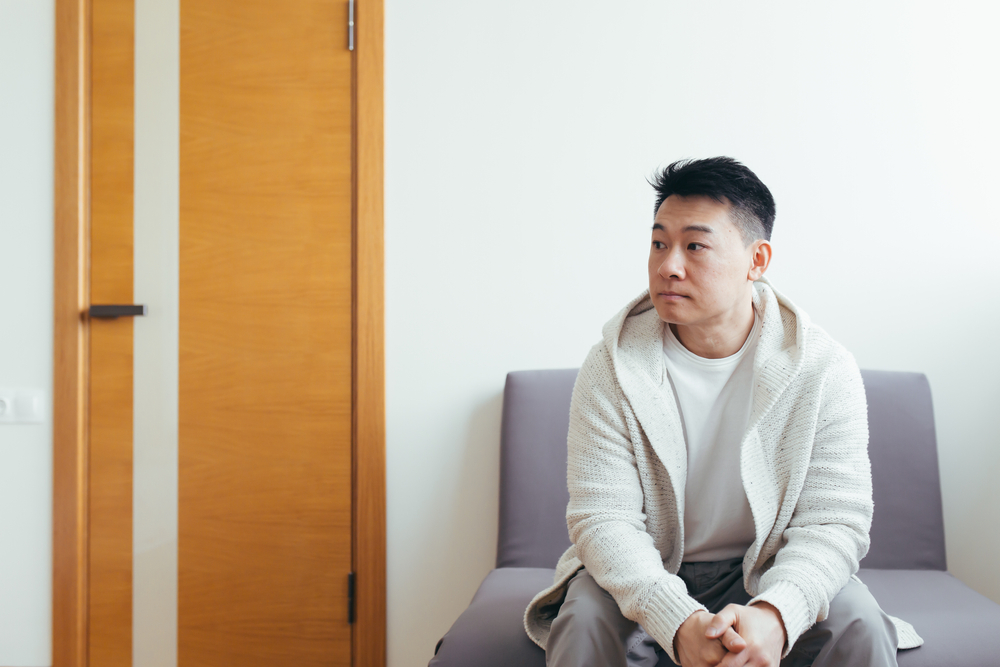 asian man waiting for appointment