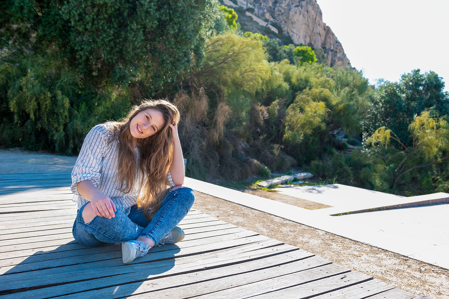 lady sitting on wood platform