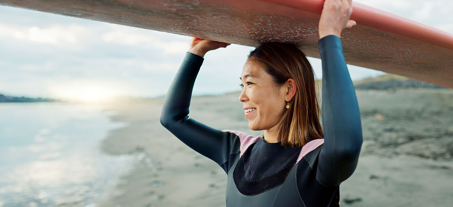 woman with surfboard on head