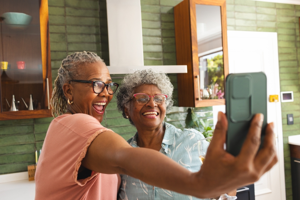 2 older black ladies taking a selfie